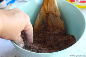 All the ingredients for these Pumpkin Spice Bath Salts sit mixed in the mixing bowl.