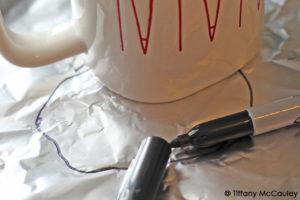 Step four is to outline your mug on foil.