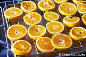 Place orange slices on oven rack with a pan under to catch the juices.