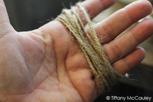 Wrap twine around your hand to make tassles.