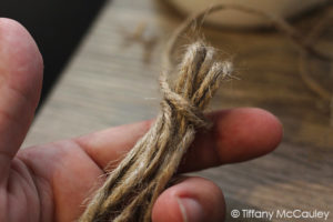 Secure the twice with another piece of twine.