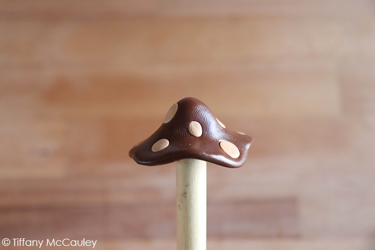 Forming the polymer clay mushrooms caps over a stylus.