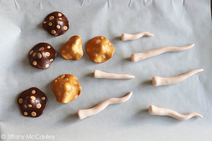 Baking the finished caps and stems for these polymer clay mushrooms.