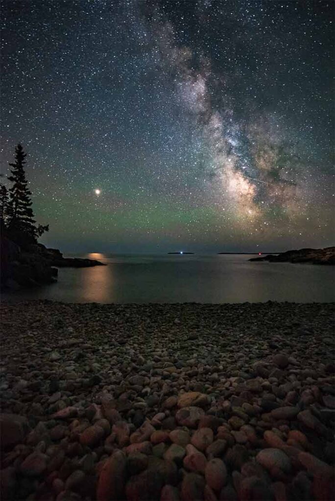 A coastline at night with a view of the milky way.