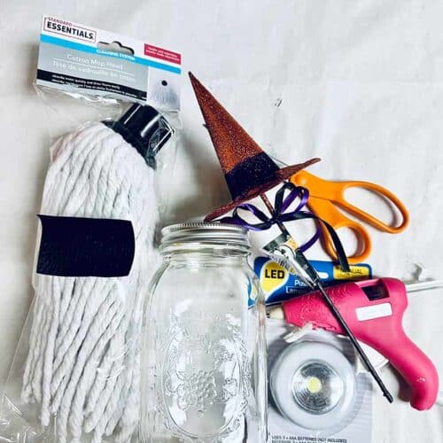 Supplies gathered on a white surface for making this DIY Halloween Ghost.