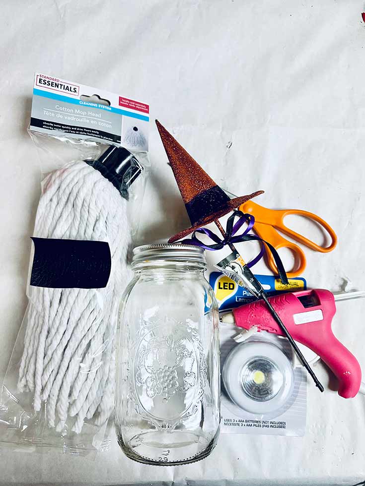 Supplies gathered on a white surface for making this DIY Halloween Ghost.