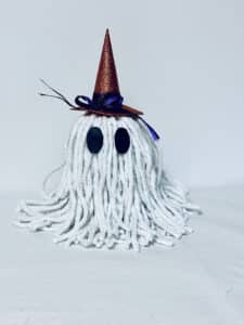 The eyes glued onto the DIY Halloween Ghost.
