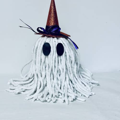 The eyes glued onto the DIY Halloween Ghost.