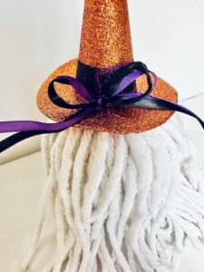 Ribbon bow added to the witch hat.